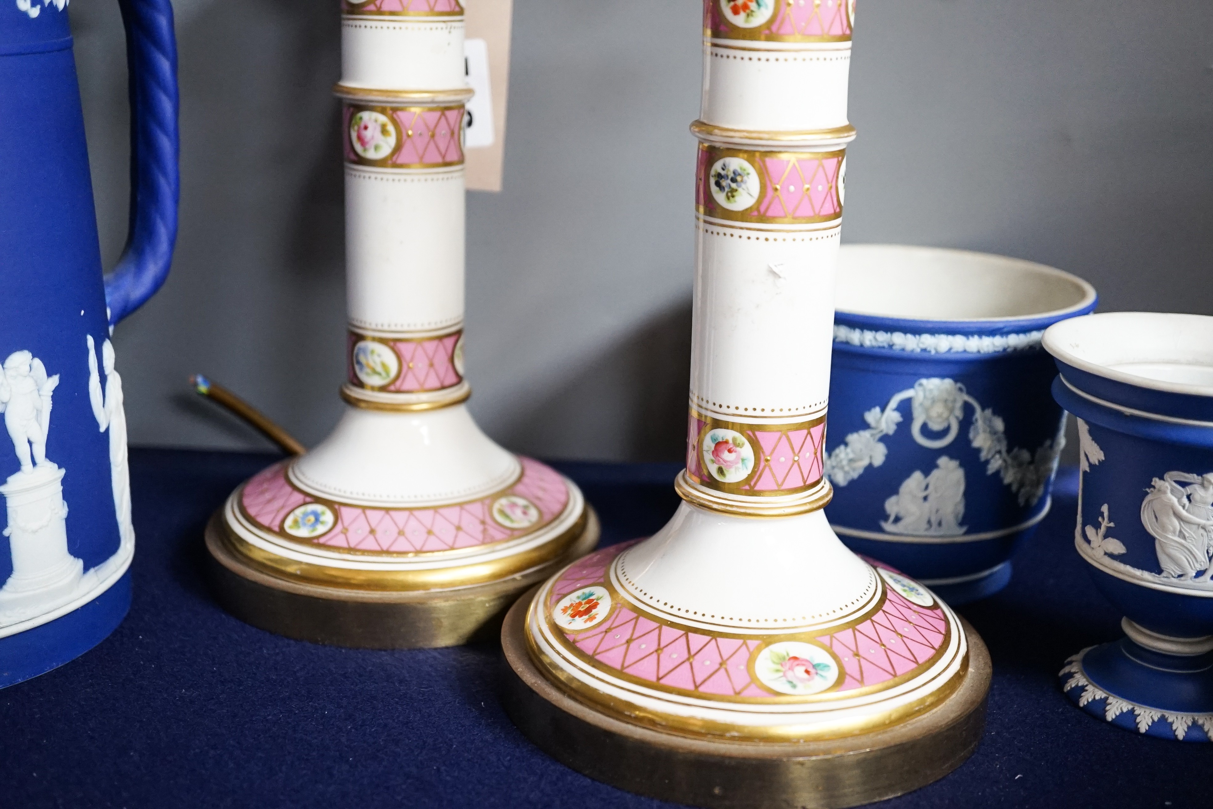 Three mid to late 19th century pieces of Wedgwood Jasperware, including a coffee pot and a small cashe-pot, a pair of 19th century porcelain candlesticks converted into lamps